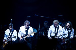 Eagles in matching shirts and ties playing onstage