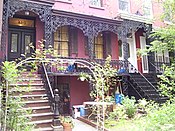 Italianate townhouses[119] on East 18th Street (1853), with cast-iron verandas reminiscent of the French Quarter of New Orleans.[118]