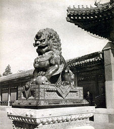 Statue of a mystical Chinese guardian lion in old Beijing, China