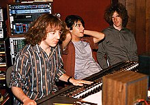 Mitch Easter sitting at a mixing board next to Michael Quercio and Scott Miller
