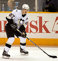 Photograph of Sydney Crosby getting ready to pass a puck
