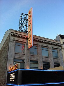 Close-up view of the upper facade and marquee of the Apollo Theater