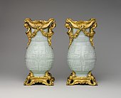 Pair of Chinese vases with French Rococo mounts; the vases: early 18th century, the mounts: 1760–70; hard-paste porcelain with gilt-bronze mounts; 32.4 x 16.5 x 12.4 cm; Metropolitan Museum of Art