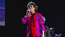 Jagger singing on stage at the Empire Polo Club in 2016