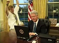 President Bill Clinton (right) with television actor Mike Maronna (left) celebrating a successful online purchase in a comedic short film recorded for the 2000 Dinner.