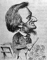A cartoon figure holding a baton, stands next to a music stand in front of some musicians. The figure has a large nose and a prominent forehead. His sideburns turn into a wispy beard under his chin.