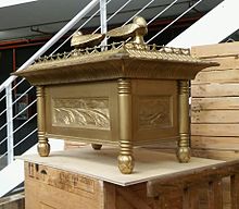 A photograph of a replica of the Ark of the Covenant on display