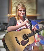 Meghan Trainor performing outside a church in 2010