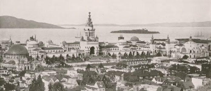 View north-northeast; the Tower of Jewels is prominent in the center, and the domed Palace of Horticulture can be seen on the left. Alcatraz Island can be seen in the background.