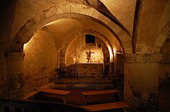 The Chamber of the Pyx, a stone room with a vaulted ceiling and an altar.