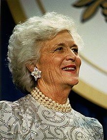 Barbara Bush smiles, looking up and to the right.