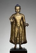 Gupta sculpture of Buddha offering protection; late 6th–early 7th century; copper alloy; height: 47 cm, width: 15.6 cm, diameter: 14.3 cm; from India (probably Bihar); Metropolitan Museum of Art