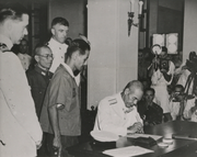 British Rear Admiral Sir Cecil Halliday Jepson Harcourt watching Japanese Vice Admiral Ruitako Fujita sign the document of surrender on 16 September 1945, in Hong Kong