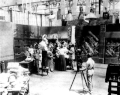 Image 15A.E. Smith filming The Bargain Fiend in the Vitagraph Studios in 1907. Arc floodlights hang overhead. (from History of film)