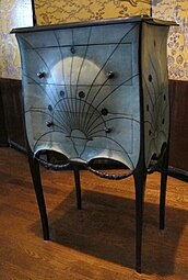 Rococo influences – Commode, by Paul Iribarne Garay (c. 1912), mahogany and tulip wood frame, slate top, green-tinted shagreen upholstery, ebony knobs, base and garlands, Museum of Decorative Arts, Paris