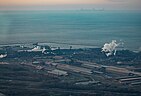 Steel mill near the Port of Indiana—Burns Harbor on Lake Michigan; Chicago skyline on horizon