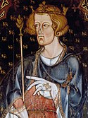 A man in medieval dress, wearing a crown and holding a sceptre