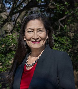 Deb Haaland is from the Laguna Pueblo people and is the first Native American Cabinet Secretary as Secretary of Interior. Her father is Norwegian-American.[57]