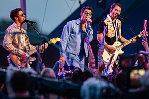 Jonas Brothers performing in 2021; L–R: Nick, Joe, and Kevin