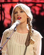 Swift singing onto a mic