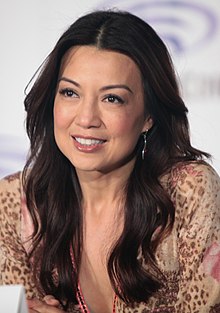 A close-up portrait of Mulan's voice actress, Ming-Na Wen, at a conference.