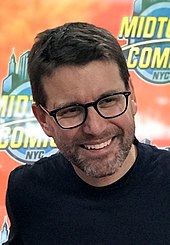 The film's co-writer Rhett Reese smiling at a 2018 event