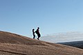 Couple strolling down Enchanted rock