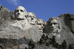 Mount Rushmore (Shrine of Democracy) by Gutzon Borglum. From left to right: Washington, Jefferson, Roosevelt, and Lincoln.