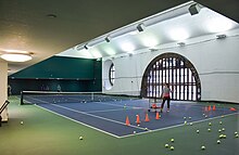 Tennis players using the terminal's court
