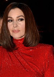 Bellucci wearing a red sequin dress