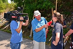 Cameraman and journalist who interviews a person in Austria