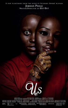In a black background, Lupita Nyong'o (portraying as her respective role and seen wearing a red jumpsuit) looks out at the viewer while holding a mask of herself. Tears is seen streaming out of her eye.