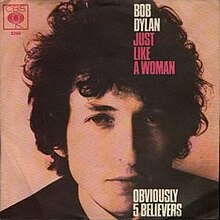 Single cover of "Just Like a Woman", a headshot of Bob Dylan looking into the camera
