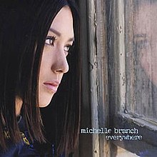 A woman with dark hair stares out of a wood-paneled window to the right. Toward the bottom right is writing that says "michelle branch", and under it, "everywhere".