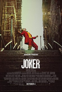The Joker dances on a set of stairs. Below him are the words "Joaquin Phoenix", "A Todd Phillips film", "Joker", the billing block, and "October 4".