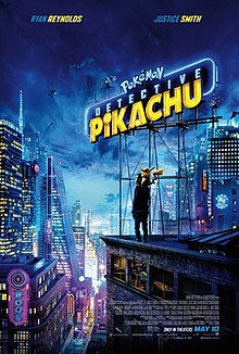 The film title is a neon sign on a rooftop in a nighttime cityscape. On the rooftop beneath the sign stands a man with a yellow creature sitting on his shoulders.