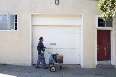 A U.S. post office delivery man on Dec. 5, 2011 in San Francisco, Calif.