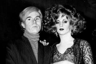 Underground filmmaker and artist Andy Warhol, left, is seen with one of his superstars, Candy Darling in 1969.
