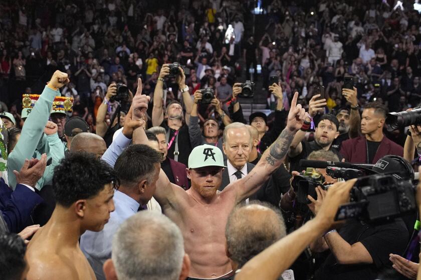Canelo Alvarez celebrates after defeating Jaime Munguia in a super middleweight title fight Saturday, May 4, 2024, in Las Vegas. (AP Photo/John Locher)