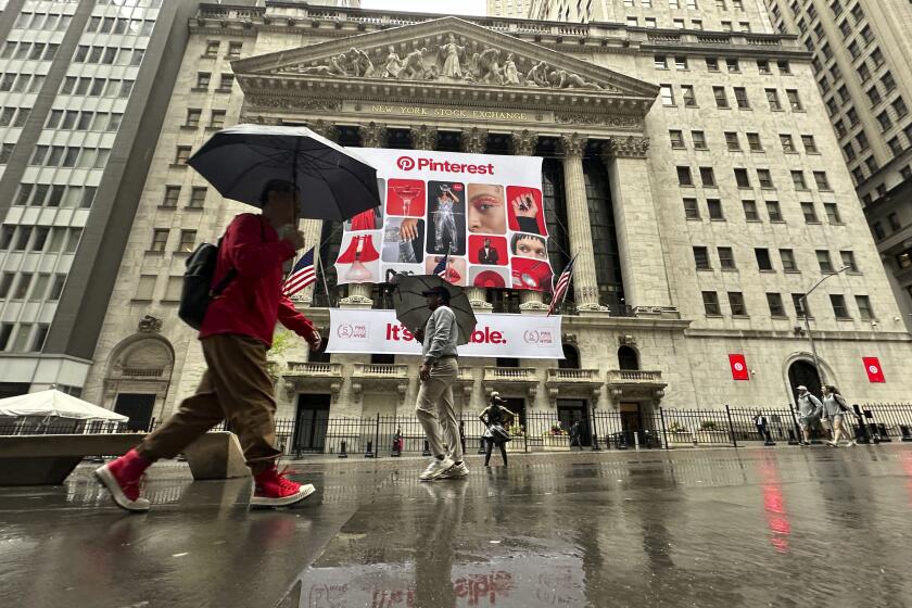 Banners for Pinterest, displayed to mark the fifth anniversary of the company's listing, hang on the front of the New York Stock Exchange in New York on Wednesday, May 15, 2024. U.S. stocks are rising toward records with hope that inflation is heading back in the right direction. (AP Photo/Peter Morgan)