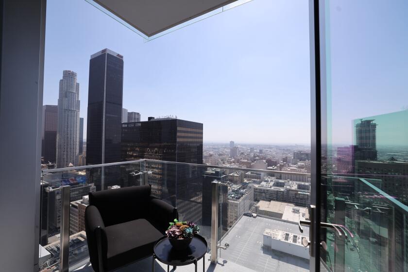 LOS ANGELES CA APRIL 30, 2024 - View of downtown Los Angeles from a balcony at Figueroa Eight, a 41-story apartment tower in downtown Los Angeles. This luxury residential building is coming to market at a time when downtown is suffering from a loss of office tenants, fear of crime and persistent homelessness. (Brian van der Brug / Los Angeles Times)