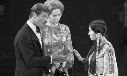 Sacheen Littlefeather, right, with Roger Moore and Liv Ullmann.