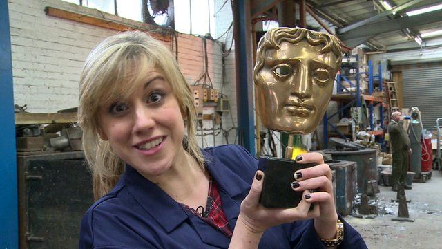 Jenny holding a Bafta award