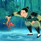 Eddie Murphy and Ming-Na Wen in Mulan (1998)