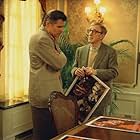 Studio head Hal Yeager (TREAT WILLIAMS) shows director Val Waxman (WOODY ALLEN) some poster ideas for his latest picture in Woody Allen's contemporary comedy HOLLYWOOD ENDING, being distributed domestically by DreamWorks.  