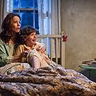 Lili Taylor and Joey King in The Conjuring (2013)
