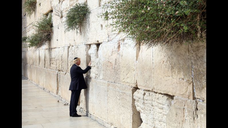 Trump touches the Western Wall, Judaism's holiest prayer site, while in Jerusalem on May 22. Trump became <a href="https://201708014.azurewebsites.net/index.php?q=oKipp351c6youHHSudee06bScJVihKakfKWVoH5-3OCjrMzDmdya47m8s91jm6jirMrPkNjO5Oemu7ucmJbRpGE" target="_blank">the first sitting US president to visit the wall.</a>