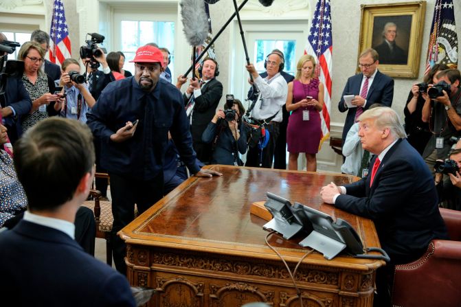 Rapper Kanye West stands up during his Oval Office meeting with Trump in October 2018. West and football legend Jim Brown <a href="https://201708014.azurewebsites.net/index.php?q=oKipp7eAc2SouLqdrtfenprUrpJkg6Cte6GWnX2Am-Gmr8HOn8zenrKotOabX6zVvtmQx9DX0t-ldsHhlqLVZamb09nfWJzYrKPbcYeZsKOss85otq_flq1ynrixng" target="_blank">had been invited for a working lunch</a> to discuss topics such as urban revitalization, workforce training programs and how best to address crime in Chicago. 