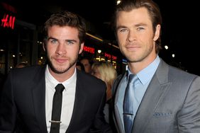 Liam Hemsworth (L) and Chris Hemsworth arrive at the premiere of Marvel's "Thor: The Dark World" at the El Capitan Theatre on November 4, 2013