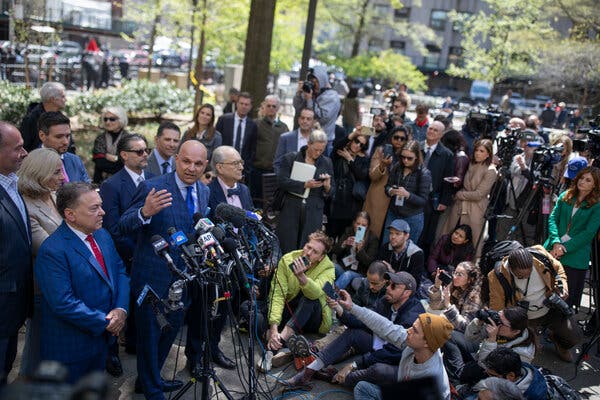 Arthur Aidala, left, the lawyer for Harvey Weinstein, speaking to the news media in Manhattan on Thursday after Mr. Weinstein’s conviction was overturned.